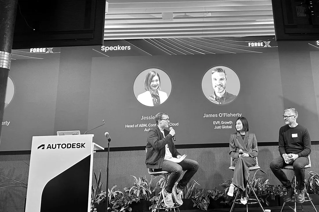 A three-person panel on stage